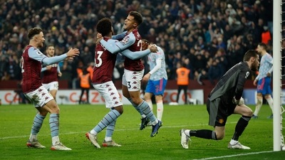 Aston Villa's Philippe Coutinho celebrates scoring their second goal with Carney Chukwuemeka and Matty Cash (Reuters)
