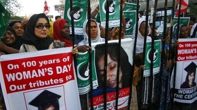 People rally demanding the release of Aafia Siddiqui, who was convicted in February 2010 of two counts of attempted murder, and who is currently being detained in the U.S. during International Women's Day in Karachi, Pakistan. (AP) People rally demanding the release of Aafia Siddiqui, who was convicted in February 2010 of two counts of attempted murder, and who is currently being detained in the U.S. during International Women's Day in Karachi, Pakistan. (AP)