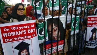 People rally demanding the release of Aafia Siddiqui, who was convicted in February 2010 of two counts of attempted murder, and who is currently being detained in the U.S. during International Women's Day in Karachi, Pakistan, (AP) People rally demanding the release of Aafia Siddiqui, who was convicted in February 2010 of two counts of attempted murder, and who is currently being detained in the U.S. during International Women's Day in Karachi, Pakistan, (AP)