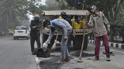 Ludhiana MC contractors repairing the damaged DMC road, one of the many built under the multi-crore road development projects launched ahead of the Punjab assembly polls. (HT Photo) Ludhiana MC contractors repairing the damaged DMC road, one of the many built under the multi-crore road development projects launched ahead of the Punjab assembly polls. (HT Photo)