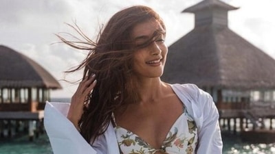 Pooja Hegde in bikini top and shorts worth ₹10k enjoys wind in her hair at the sea: See new pic Pooja Hegde in bikini top and shorts worth ₹10k enjoys wind in her hair at the sea: See new pic