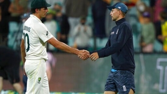 Australia's captain Pat Cummins, left, shakes hands with England's captain Joe Root after their Ashes cricket Test match in Hobart, (AP)