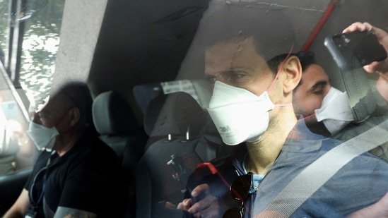 Serbian tennis player Novak Djokovic departs the Park Hotel while under immigration detention, to convene with his legal team after his visa to play in the Australian Open was cancelled a second time, in Melbourne, Australia, January 16, 2022.(REUTERS)