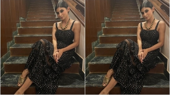 Mouni styled the ensemble with gold peep-toe block heel sandals and a chunky gold necklace featuring black thread and large beads. The star ditched all other jewels to keep the ensemble the star of her look.(Instagram/@imouniroy)