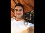 Screengrab from the cat video where the new cat dad couldn't help but smile at his feline friend. (reddit/@Interesting_Sale_847) Screengrab from the cat video where the new cat dad couldn't help but smile at his feline friend. (reddit/@Interesting_Sale_847)