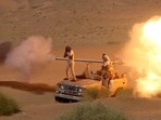 Yemeni government army soldiers fire a cannon mounted on a vehicle at the frontline of fighting against Houthis in Marib, Yemen in this undated photo provided by Yemen's Armed Forces on January 14, 2022.&nbsp;
