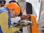 PM Modi receives 'parsad' after paying obeisance at Gurdwara Sri Ber Sahib in Sultanpur Lodhi, Punjab.(PTI File Photo)