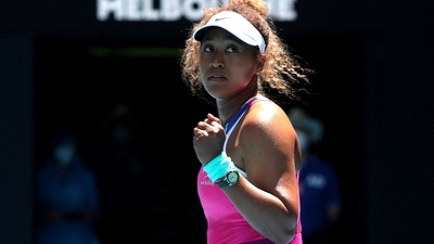 Naomi Osaka celebrates after winning her first round match against Colombia's Camila Osorio (REUTERS)