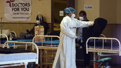 A healthcare workers tends to patients at a Covid-19 care centre, in New Delhi, on Monday. (Raj K Raj/HT Photo) A healthcare workers tends to patients at a Covid-19 care centre, in New Delhi, on Monday. (Raj K Raj/HT Photo)