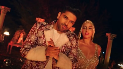 Guru Randhawa and Nora Fatehi in the Dance Meri Rani video.