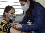 A medic administers Covid vaccine to a teen in Ludhiana at the civil surgeon’s office. The vaccination drive for this group began on January 3. (HT Photo)