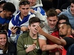 Nick Kyrgios of Australia takes a selfie with the crowd after defeating Liam Broady of Britain in their first round match at the Australian Open tennis championships in Melbourne, Australia, Tuesday, Jan. 18, 2022. Nick Kyrgios of Australia takes a selfie with the crowd after defeating Liam Broady of Britain in their first round match at the Australian Open tennis championships in Melbourne, Australia, Tuesday, Jan. 18, 2022.