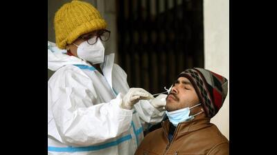 A health worker collects swab samples in Patna on Tuesday. (Santosh Kumar/HT photo)