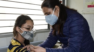 A medic administers Covid vaccine to a teen in Ludhiana at the civil surgeon’s office. The vaccination drive for this group began on January 3. (HT Photo) A medic administers Covid vaccine to a teen in Ludhiana at the civil surgeon’s office. The vaccination drive for this group began on January 3. (HT Photo)