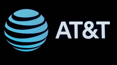 The company logo for AT&amp;T is displayed on a screen on the floor at the New York Stock Exchange (NYSE) in New York. (REUTERS)