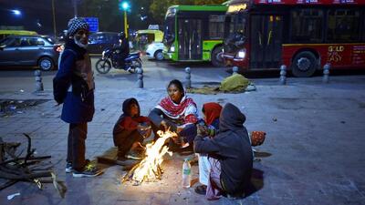 People huddle around a bonfire on a cold winter evening at Nizamuddin, on Tuesday. (Sanjeev Verma/HT PHOTO) People huddle around a bonfire on a cold winter evening at Nizamuddin, on Tuesday. (Sanjeev Verma/HT PHOTO)