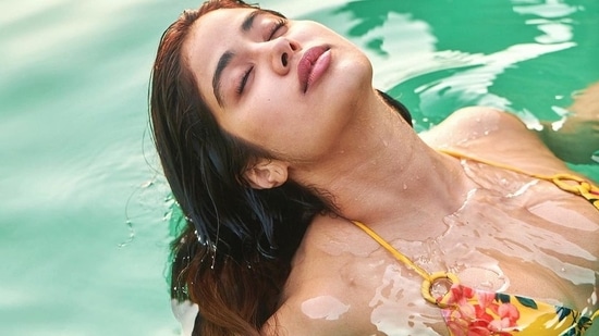 Janhvi Kapoor flaunts sizzling pool party look in yellow halter-neck bikini&nbsp;(Instagram/janhvikapoor)