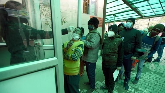 “However, it is seen from the data available on the ICMR portal that testing has declined in many states and Union territories,” Union health ministry said in its letter to states, UTs. In picture - A health worker collects swab samples for Covid test in Noida.(HT Photo)