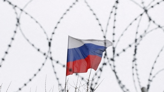 The Russian flag is seen through barbed wire as it flies on the roof of the Russian embassy in Kiev, Ukraine. (Representational image)(REUTERS)