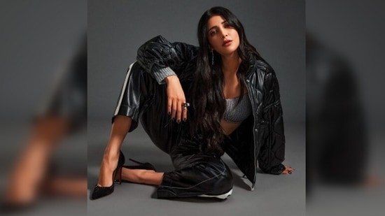For another still, Shruti Haasan donned a ribbed blouse and trousers by KGL. She paired her look with a black leather jacket by Zara and pumps by Christian Louboutin. For jewellery, she wore chain link earrings by Valliyan jewellery and a pearl ring by Isharya.(Instagram/@shrutzhaasan)