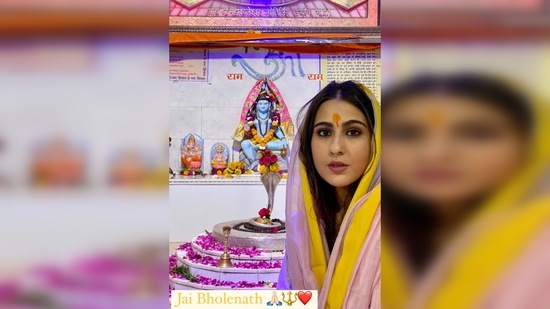 In her first story, Sara Ali Khan poses in a salwar suit in front of an idol of Lord Shiva and captioned her post, “Jai Bholenath”.(Instagram/@saraalikhan95)
