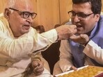 Nitin Agarwal (right) being offered sweets by Uttar Pradesh assembly speaker Hriday Narayan Dikshit after former's election as deputy speaker of the assembly on October 18, 2021 (PTI Photo)