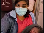 The image, posted on Twitter, showcases the doctor holding the baby she helped deliver.(Twitter/@AishaKhatib)