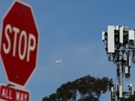 A plane flies by a cellular tower as it takes off from San Francisco International Airport on January 18, 2022, in San Bruno, California. (AFP) A plane flies by a cellular tower as it takes off from San Francisco International Airport on January 18, 2022, in San Bruno, California. (AFP)