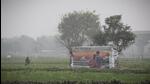 A field in Mayur Vihar shrouded in a layer of fog on Wednesday. Experts said models that make use of widely available, low-cost sensor data and satellite imagery have the potential to provide daily local air quality information to thousands of people. (Sanchit Khanna/Hindustan Times)