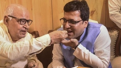 Nitin Agarwal (right) being offered sweets by Uttar Pradesh assembly speaker Hriday Narayan Dikshit after former's election as deputy speaker of the assembly on October 18, 2021 (PTI Photo)