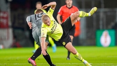 Erling Haaland falls during the German Soccer Cup match between FC St. Pauli and Borussia Dortmund in Hamburg, Germany (AP) Erling Haaland falls during the German Soccer Cup match between FC St. Pauli and Borussia Dortmund in Hamburg, Germany (AP)