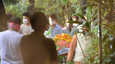 Varun Dhawan and Rohit Dhawan at the funeral in Mumbai.