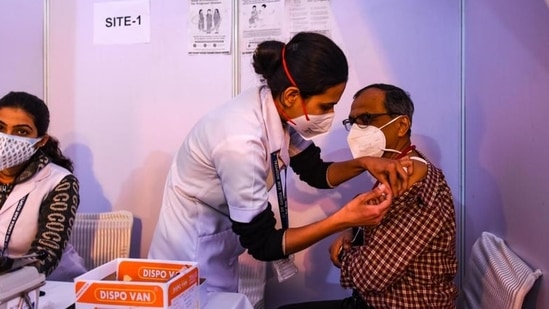 A doctor being inoculated with a booster dose of Covid-19 vaccine, at Ganga Ram Hospital, in New Delhi. (Amal KS/HT Photo)