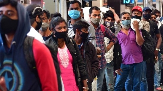 Passengers arriving on outstation trains queue up for Covid-19 test by BMC at CSMT station in Mumbai.(Bhushan Koyande/HT Photo) Passengers arriving on outstation trains queue up for Covid-19 test by BMC at CSMT station in Mumbai.(Bhushan Koyande/HT Photo)