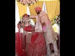 The bride having fun during the varmala ceremony and teasing her groom. (instagram/@parulgargmakeup) The bride having fun during the varmala ceremony and teasing her groom. (instagram/@parulgargmakeup)