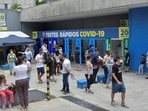 People wait at a rapid testing site in Brazil.&nbsp;