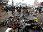 Police officials examine the site of bomb explosion, in Lahore, Pakistan, Thursday, Jan. 20, 2022. Police said the powerful bomb exploded in a crowded bazaar in Pakistan's second largest city of Lahore. (AP Photo/K.M. Chaudary) Police officials examine the site of bomb explosion, in Lahore, Pakistan, Thursday, Jan. 20, 2022. Police said the powerful bomb exploded in a crowded bazaar in Pakistan's second largest city of Lahore. (AP Photo/K.M. Chaudary)