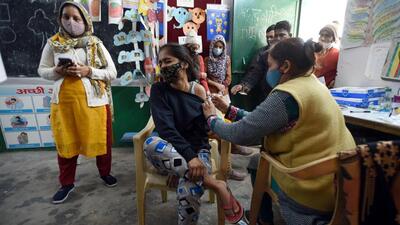 A health worker administers a dose of the Covid-19 vaccine to a girl, in Noida on Thursday. (Sunil Ghosh/ HT)