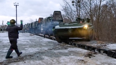 A Russian armoured vehicle drives off a railway platform after arrival in Belarus, on Wednesday. (AP Photo)
