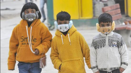 Keeping Covid safety norms in mind, children sporting unique face masks at the Sector-17 Plaza in Chandigarh on Thursday. (Keshav Singh/HT)