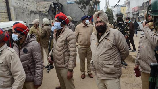 Security personnel deployed at Shimla Puri area on Gill Road after clash between Congress candidate Kamaljit Singh Karwal and Lok Insaaf Party MLA Simarjit Singh Bains’ supporters in Ludhiana on Thursday. (Gurpreet Singh/HT)