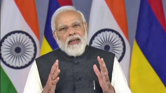 Prime Minister Narendra Modi speaks at the inauguration of India-assisted social housing units project, civil service college and 8MW Solar PV Farm projects in Mauritius on Thursday. (ANI)