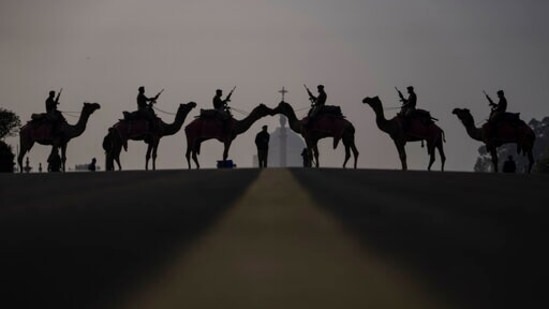 Camel-mounted soldiers stand in formation during rehearsals for the upcoming Beating Retreat ceremony at Raisina hill which houses India's most important offices and the presidential palace in New Delhi.(AP)
