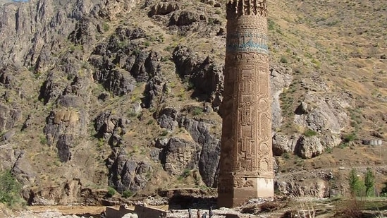 Afghan men working at a site near the Minaret of Jam in the Shahrak District of Ghor Province.(AFP)