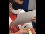 The image, taken from the video shared by Guinness World Records, shows the teen solving the Rubik's Cube blindfolded.(Instagram/@guinnessworldrecords) The image, taken from the video shared by Guinness World Records, shows the teen solving the Rubik's Cube blindfolded.(Instagram/@guinnessworldrecords)