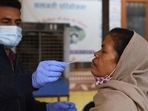 A health worker takes a person’s swab sample for RT-PCR Covid-19 testing at an UPHC in Wazirabad, in Gurugram. (Photo by Vipin Kumar / Hindustan Times) A health worker takes a person’s swab sample for RT-PCR Covid-19 testing at an UPHC in Wazirabad, in Gurugram. (Photo by Vipin Kumar / Hindustan Times)