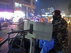 A member of the Taliban forces sits in a vehicle at a checkpoint along a street in Jalalabad. A member of the Taliban forces sits in a vehicle at a checkpoint along a street in Jalalabad. 