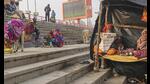 A sadhu reads a newspaper on the banks of Saryu river on a cold winter morning in Ayodhya. (PTI Photo) A sadhu reads a newspaper on the banks of Saryu river on a cold winter morning in Ayodhya. (PTI Photo)