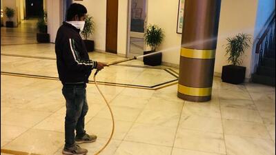 Sanitisation underway at UT Guest House, Chandigarh, after 55 guests and staff members tested positive for Covid-19 on Friday. (HT Photo)