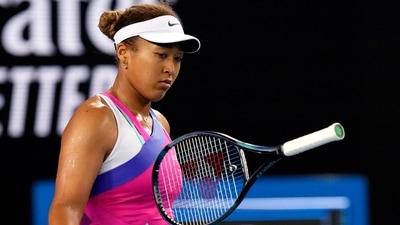 Naomi Osaka of Japan bounces her racket in frustration during her third Rond match against Amanda Anisimova of the U.S. at the Australian Open&nbsp; (AP)